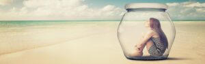 Woman in a Glass Jar on a Beach